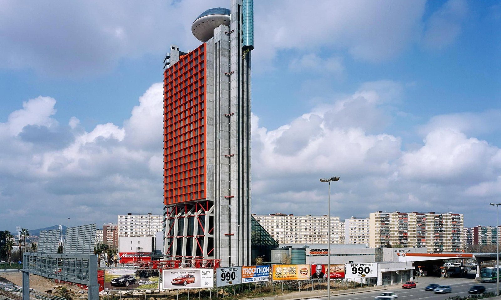 building with red grid and unique rooftop structure in California.